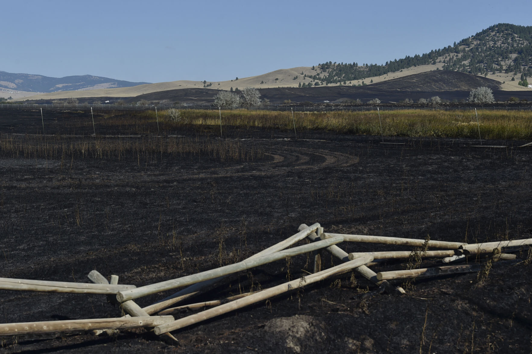 Burnt ground blankets the area